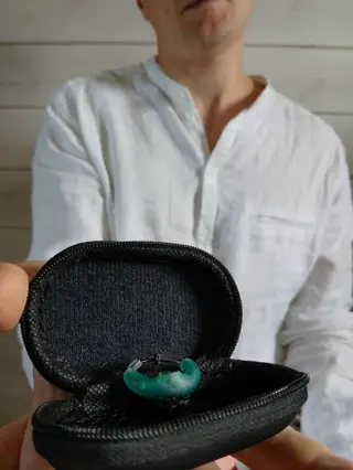 Founder holding prototype in case