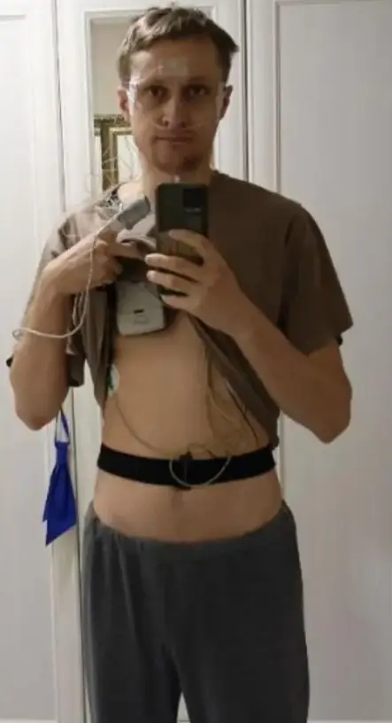 Founder wearing sleep-study sensors on chest and abdomen
