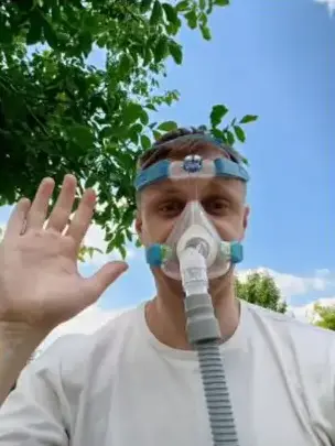 Founder wearing a CPAP mask outdoors